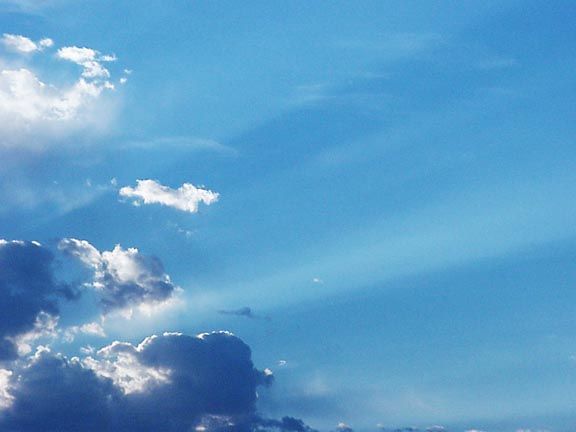 Crepuscular Rays beaming out from behind a cloud