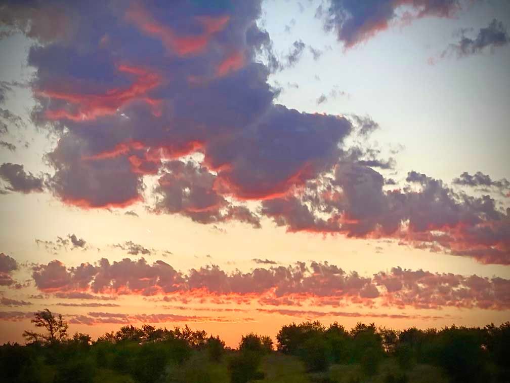 Clouds catching the morning sunrise in Bennington, Colorado 