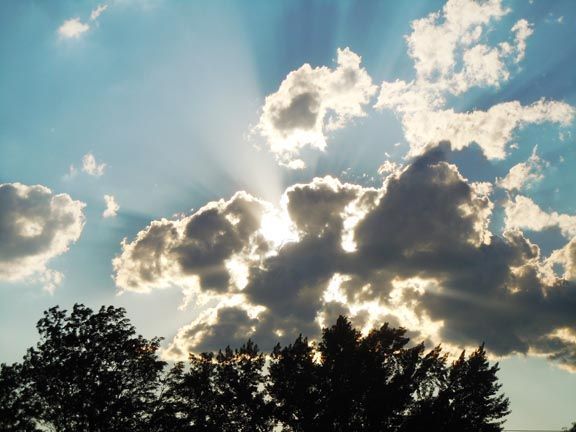 The sun hiding behind clouds