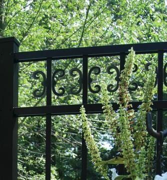 A wrought iron fence with the number 3636 on it