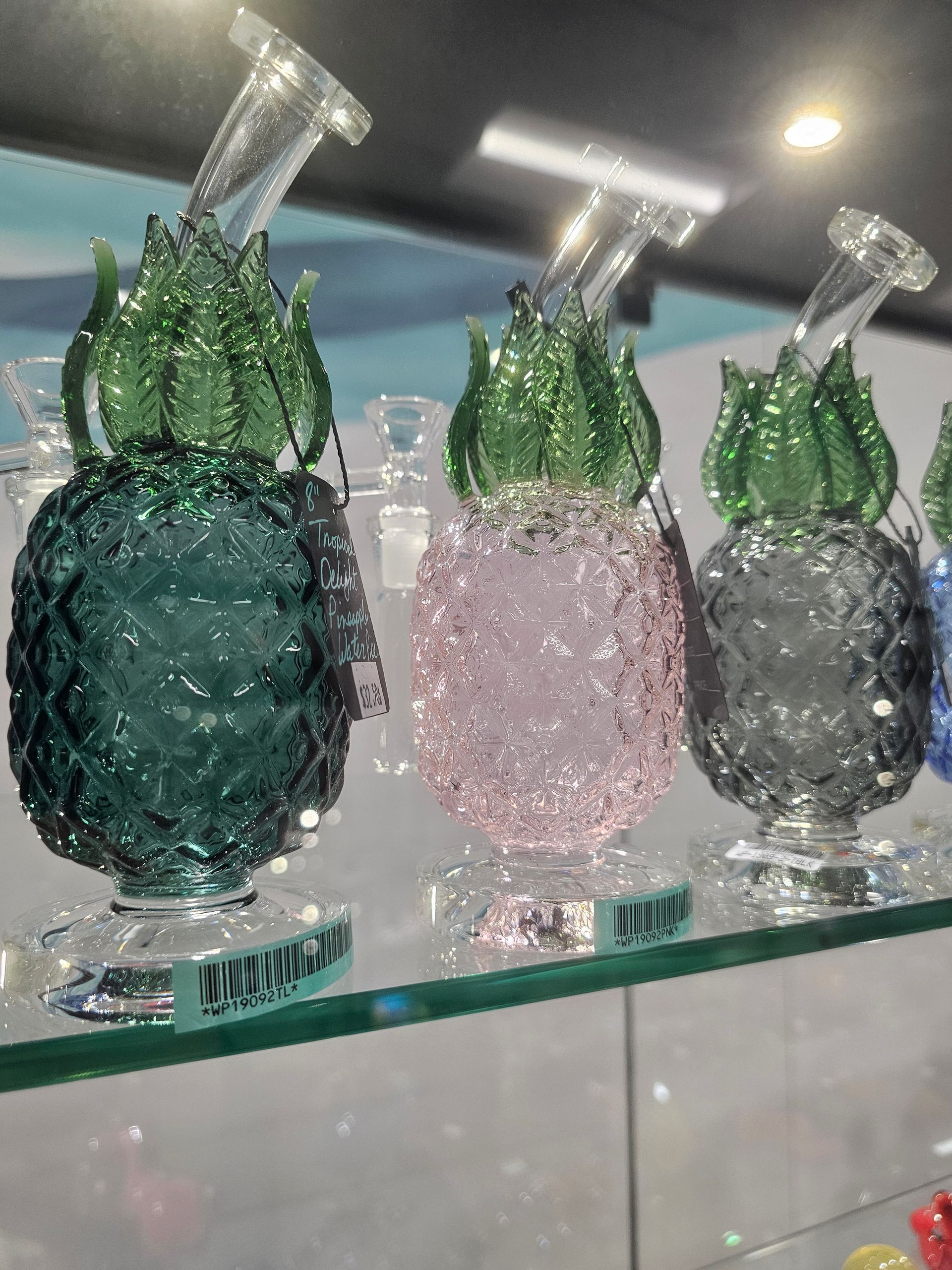 A display case filled with boxes of geek bar electronic cigarettes.