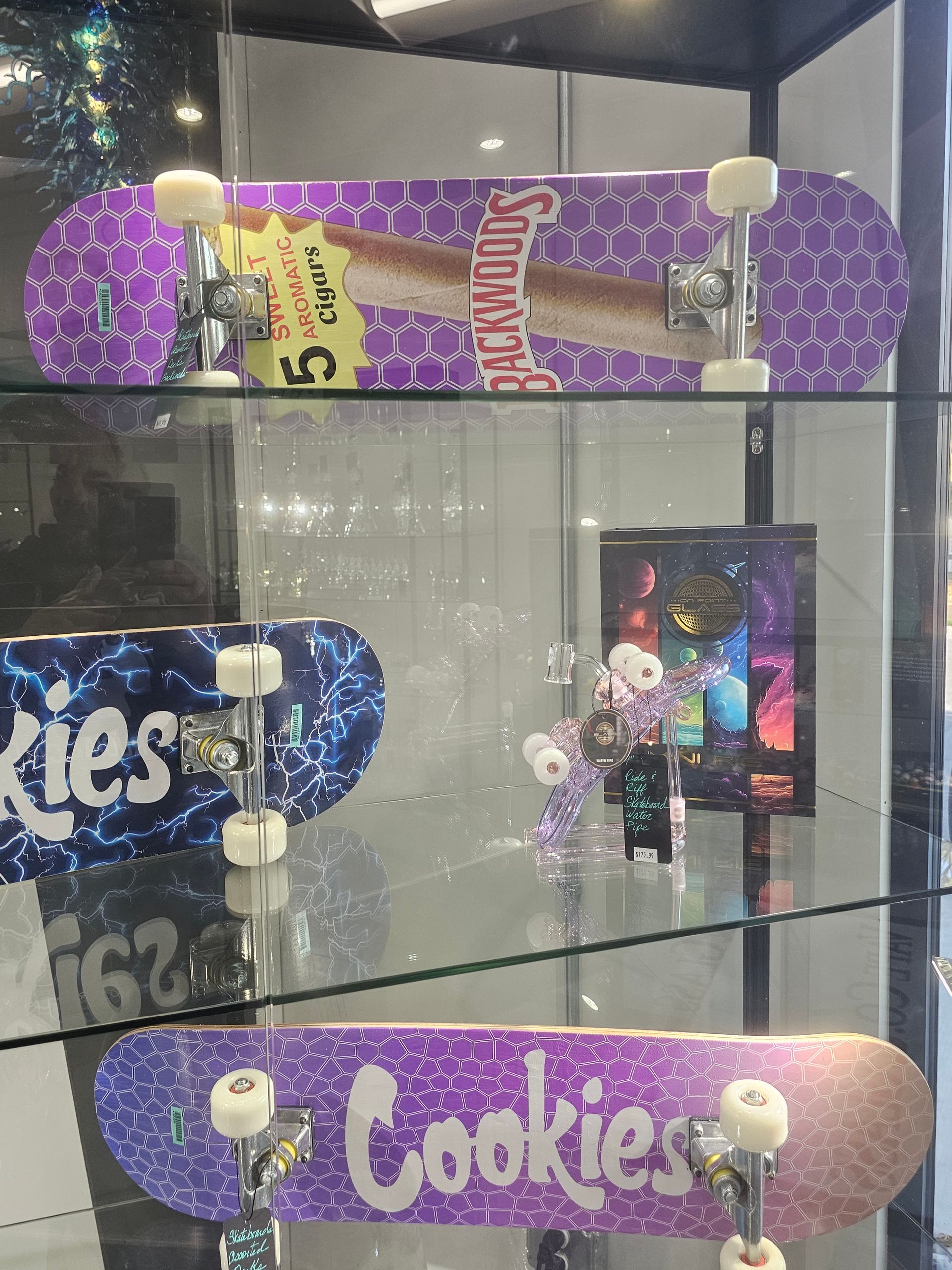 A glass display case filled with vape co. and glass products.