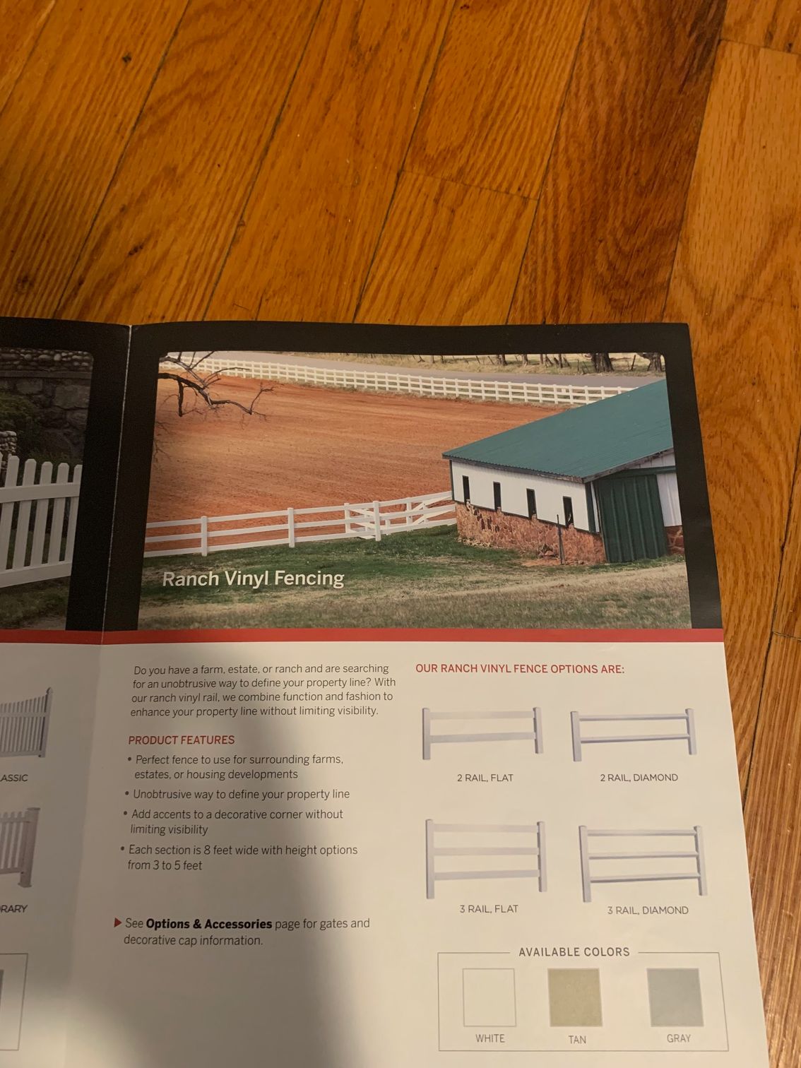 Brochure with a vinyl fencing example in a field near a building.