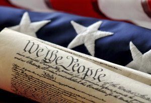 constitution in front of american flag