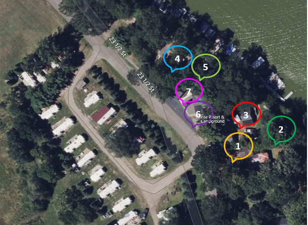 An aerial view of a campground with a lot of camper trailers.