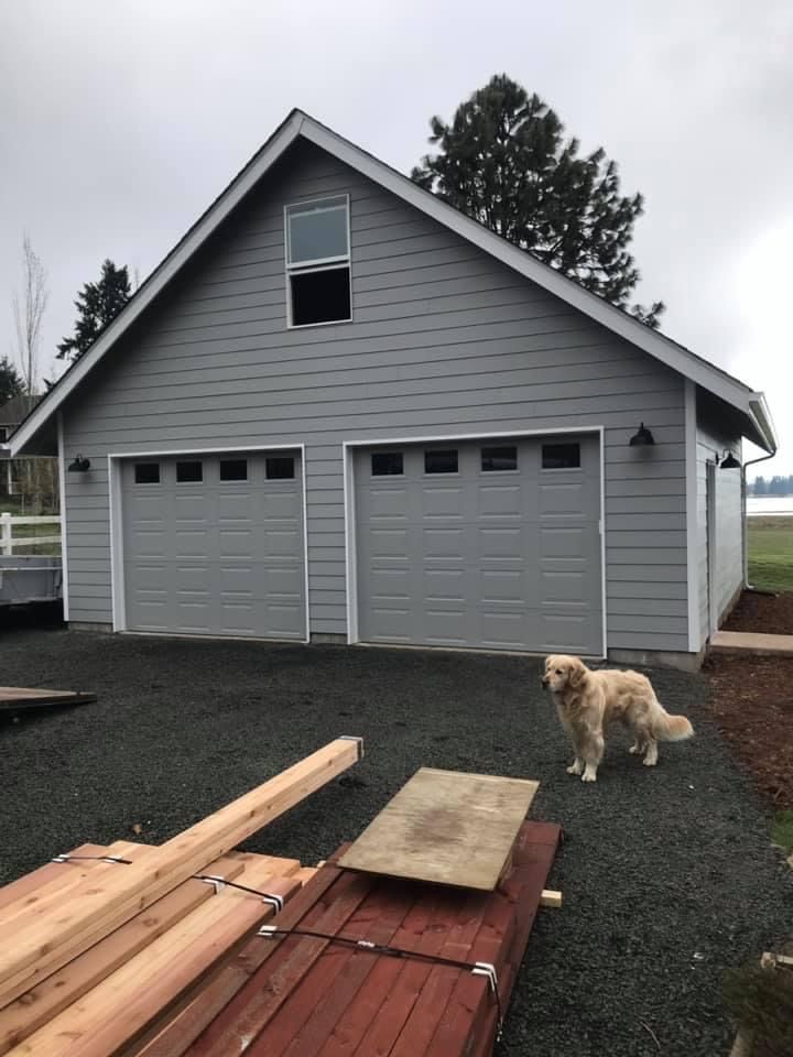 Brick wall construction in progress, showing red and white bricks, cement blocks, and insulation. A person is seen working.