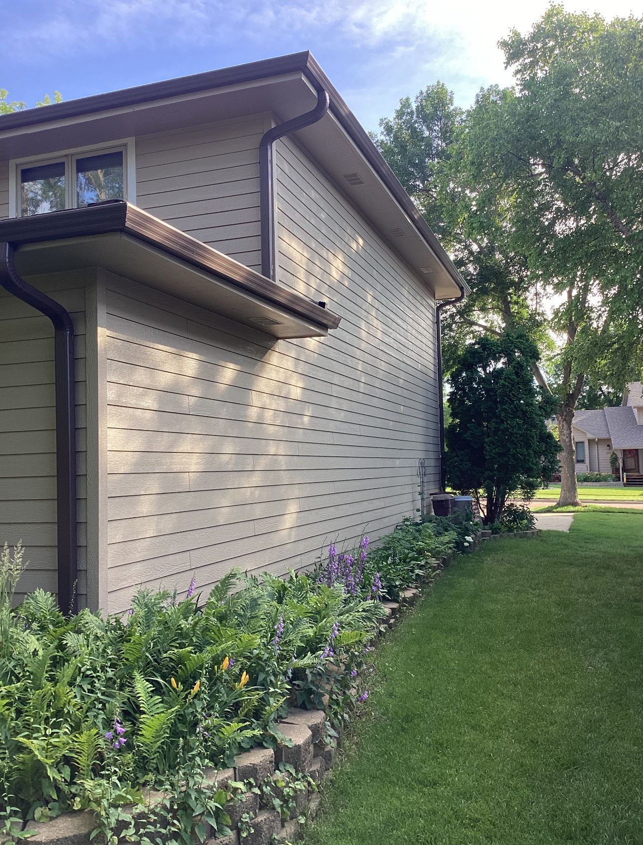 A house with a gutter on the side of it