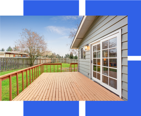 a house with a wooden deck and sliding glass doors