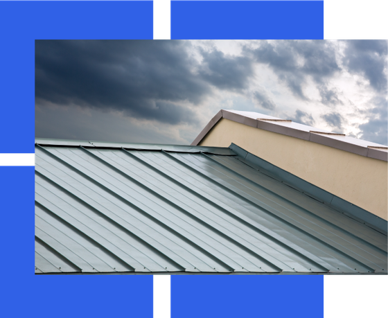 a picture of a metal roof with a cloudy sky in the background