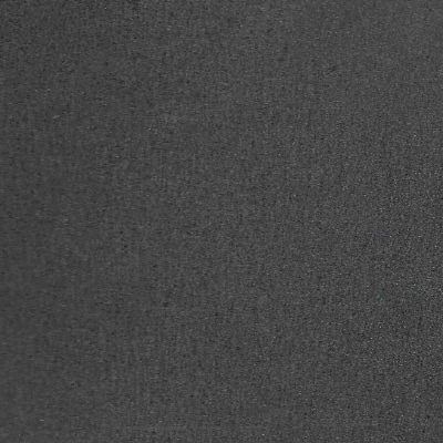 Un gros plan d'une texture de tapis noir.