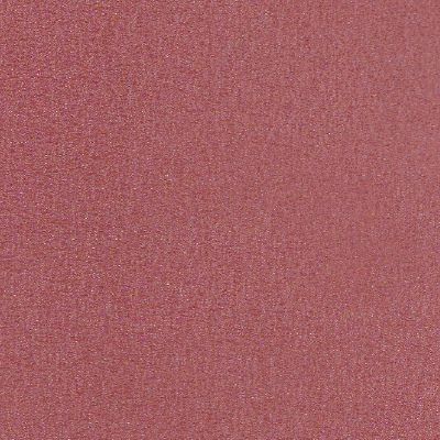 Un gros plan d'une surface rose scintillante.