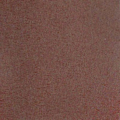 Un gros plan d'une texture de tapis marron.