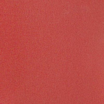 Un gros plan d'une texture de tapis rouge.