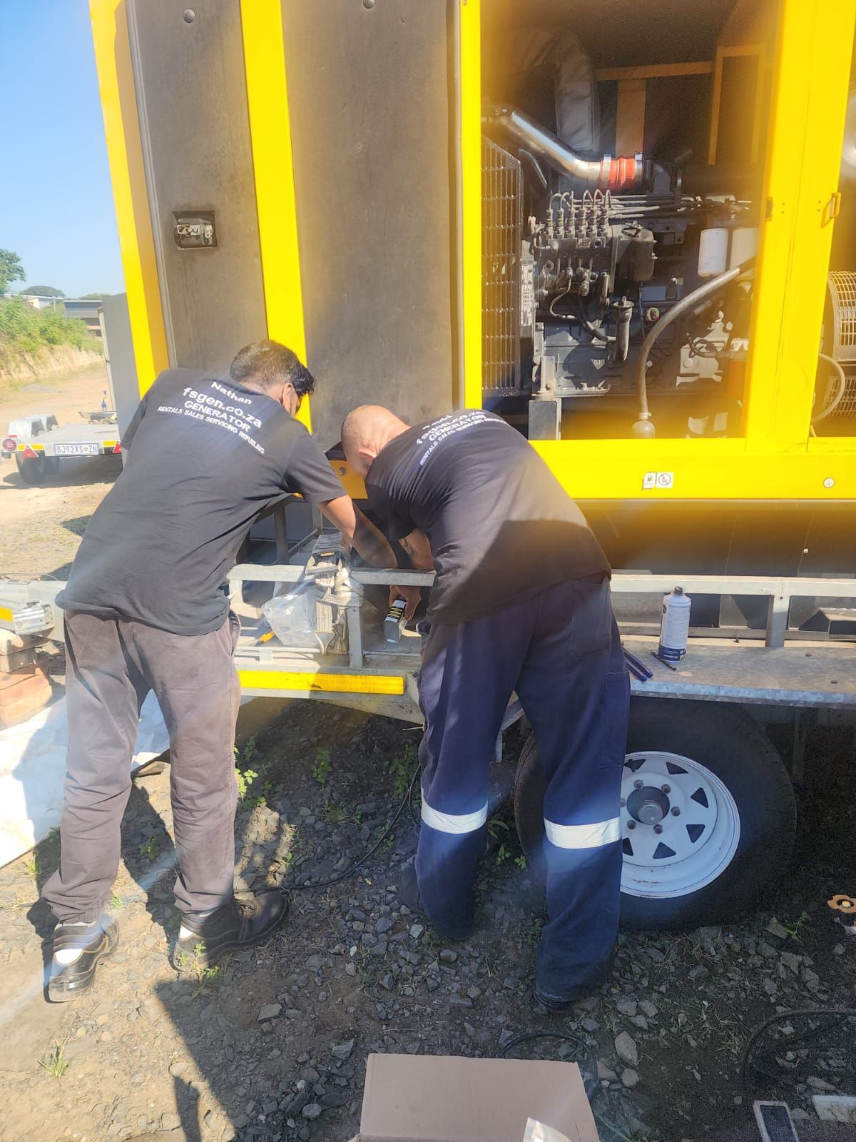 A man is working on a roof with a torch