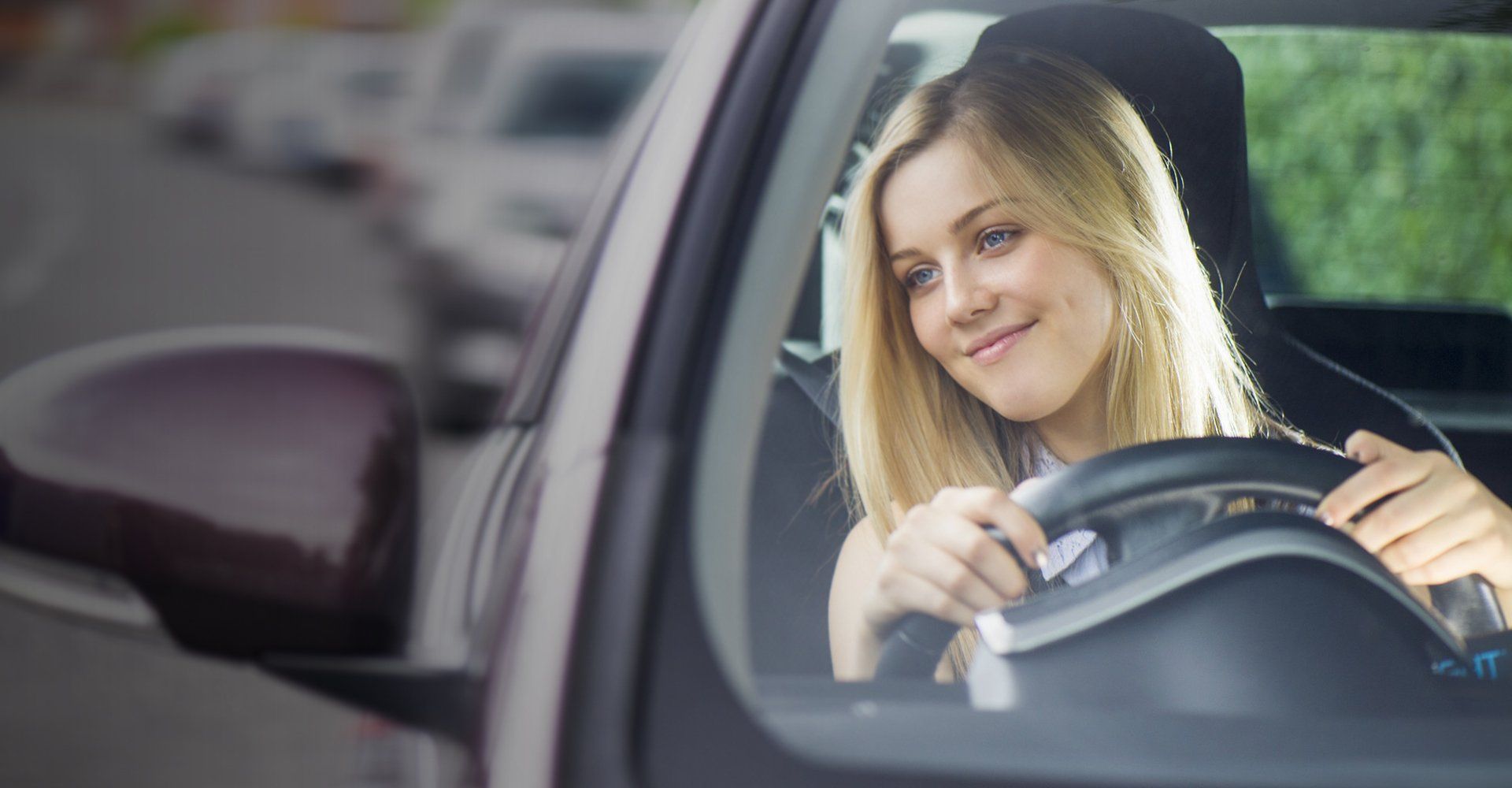 A woman looking out of the car