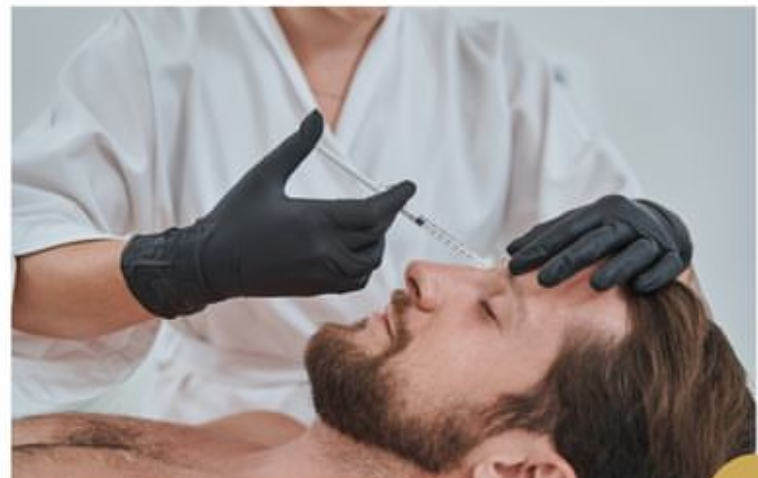 A person receiving a Botox injection in the forehead