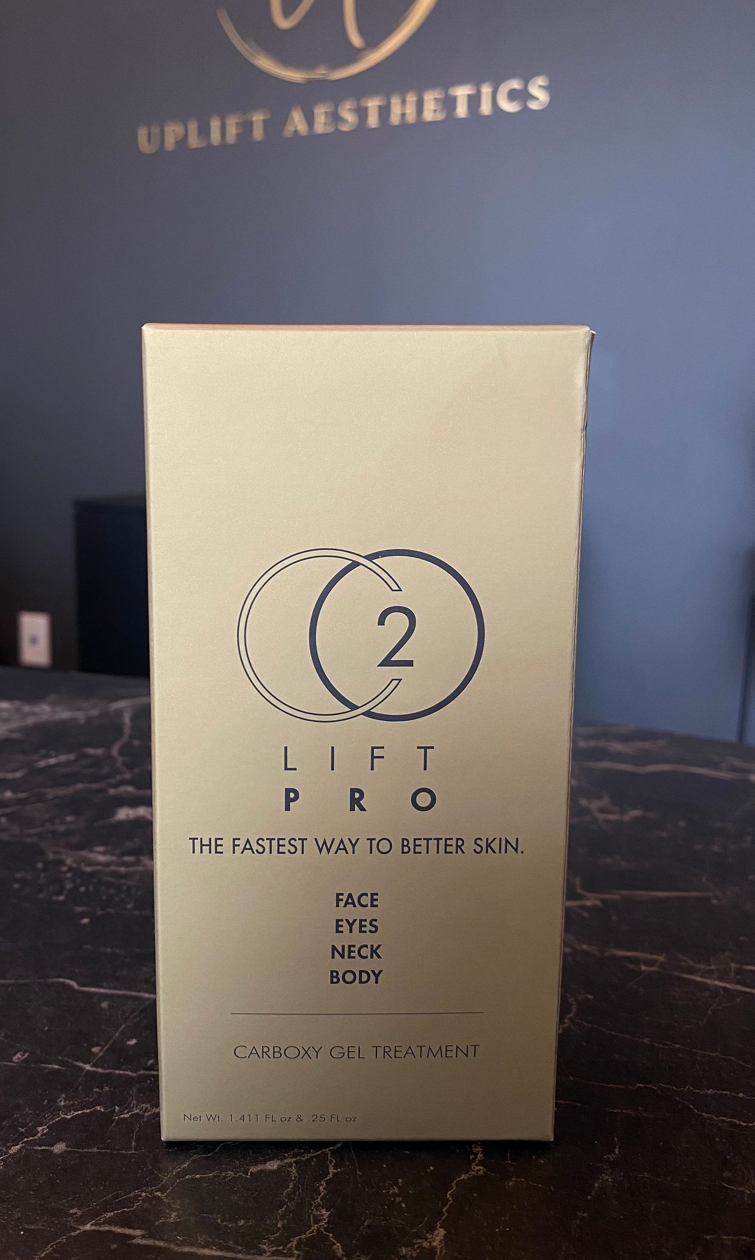 Box of CO2 Lift Pro skincare product; tan with black text and logo