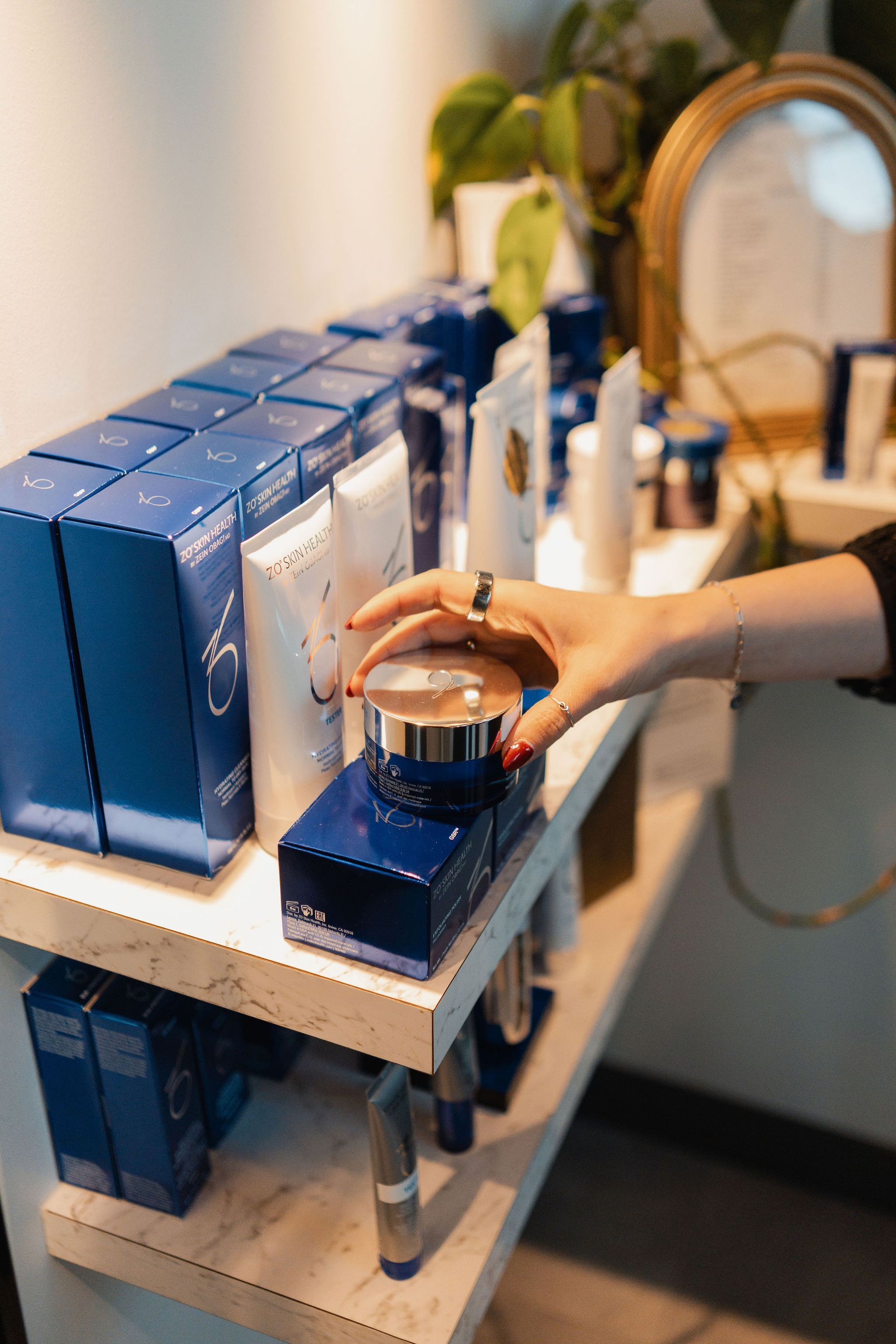 Laser hair removal treatment on a person's leg. Black laser device near the knee.