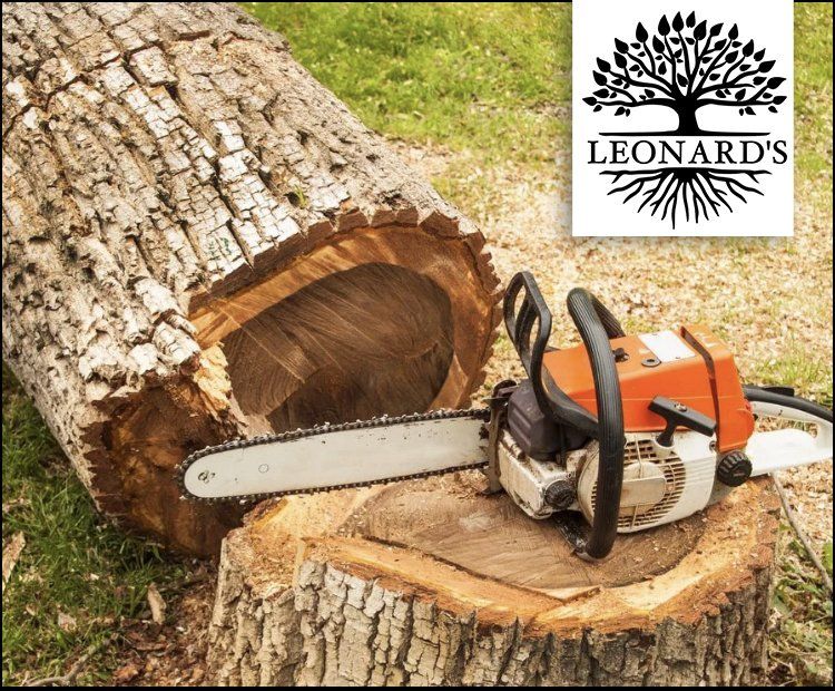 snow plow removing snow in parking lot