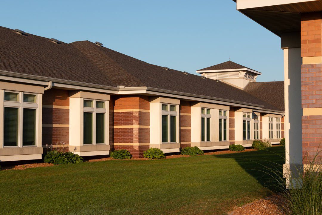 A row of brick buildings with a lot of windows