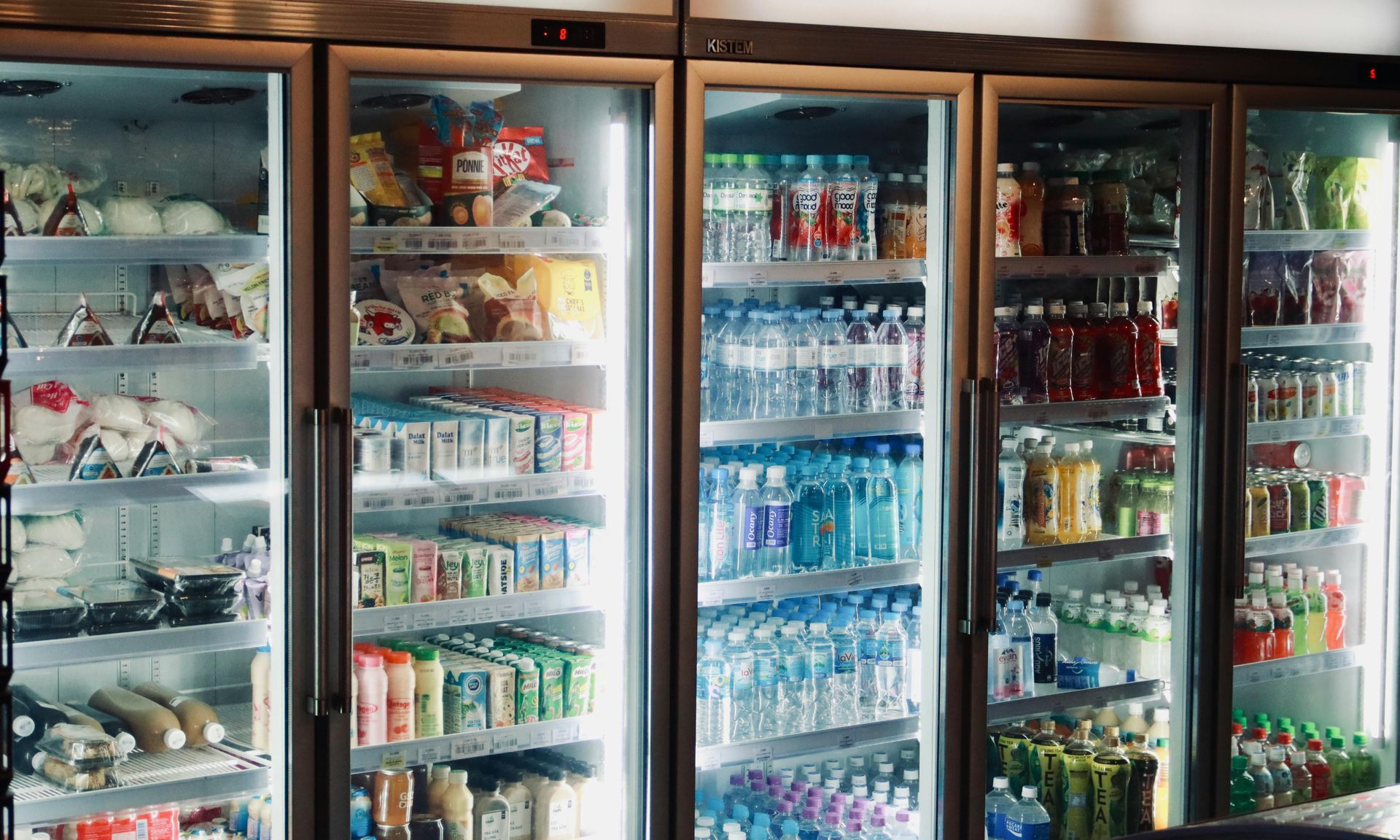 A refrigerator filled with lots of drinks and food.