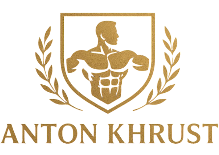 Gold logo featuring a muscular figure inside a shield crest, flanked by laurel branches, above the text 