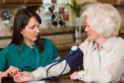 Nurse Taking Blood Pressure of a Elder Patient - Home Health Aide in Joliet, IL