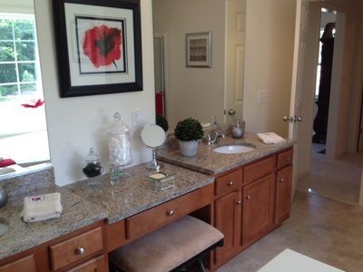 A bathroom with two sinks and a mirror