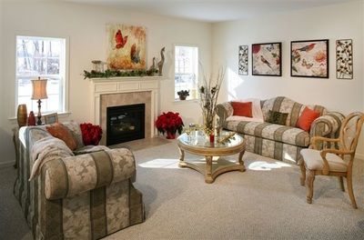 A living room filled with furniture and a fireplace.