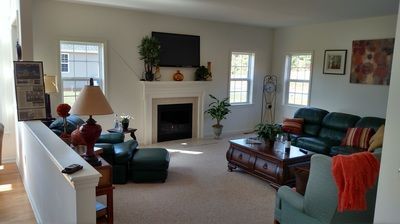 A living room filled with furniture and a fireplace.
