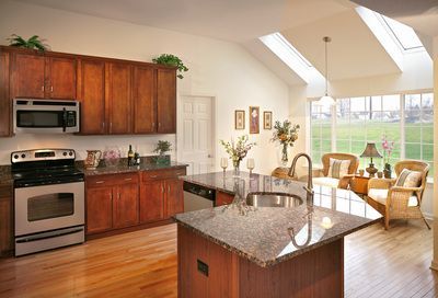 A kitchen with stainless steel appliances and granite counter tops