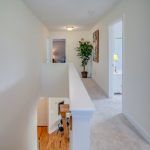 A view of a hallway from the second floor of a house.
