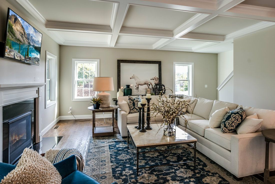 A living room filled with furniture and a fireplace.