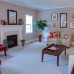 A living room filled with furniture and a fireplace.
