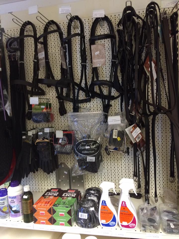 a display of equestrian products including gloves and bridles