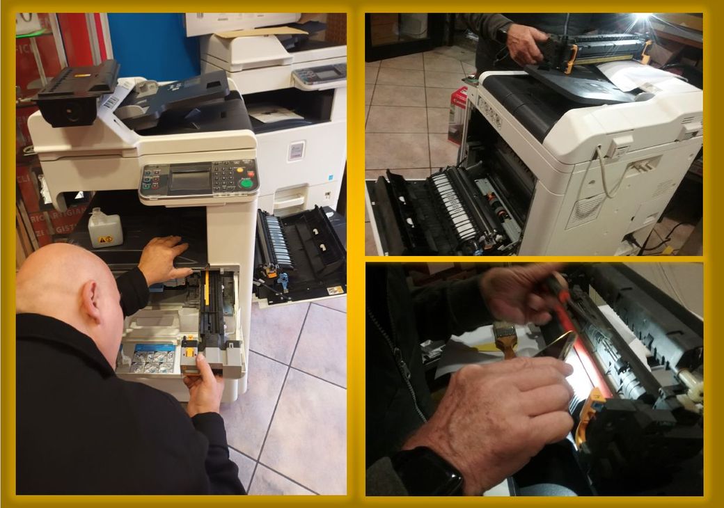 Persona che sostituisce le cartucce di toner in una stampante multifunzione. Colori visibili: ciano, magenta, giallo, nero.