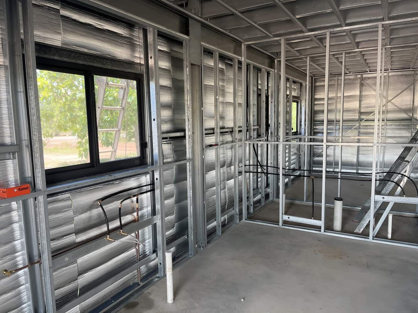 A Room With a Lot of Metal Frames and Windows — John Day Plumbing in Marlow Lagoon, NT