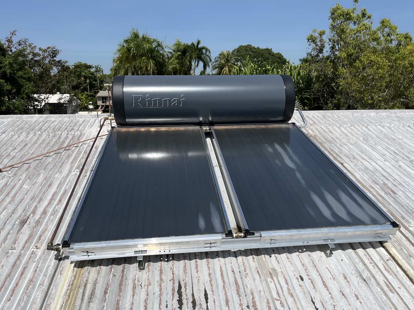 A Solar Water Heater is Sitting on Top of a Roof — John Day Plumbing in Marlow Lagoon, NT