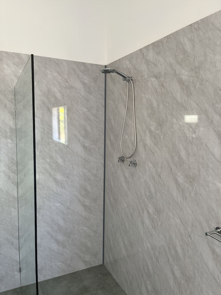 A Bathroom With a Walk in Shower and Marble Walls — John Day Plumbing in Marlow Lagoon, NT