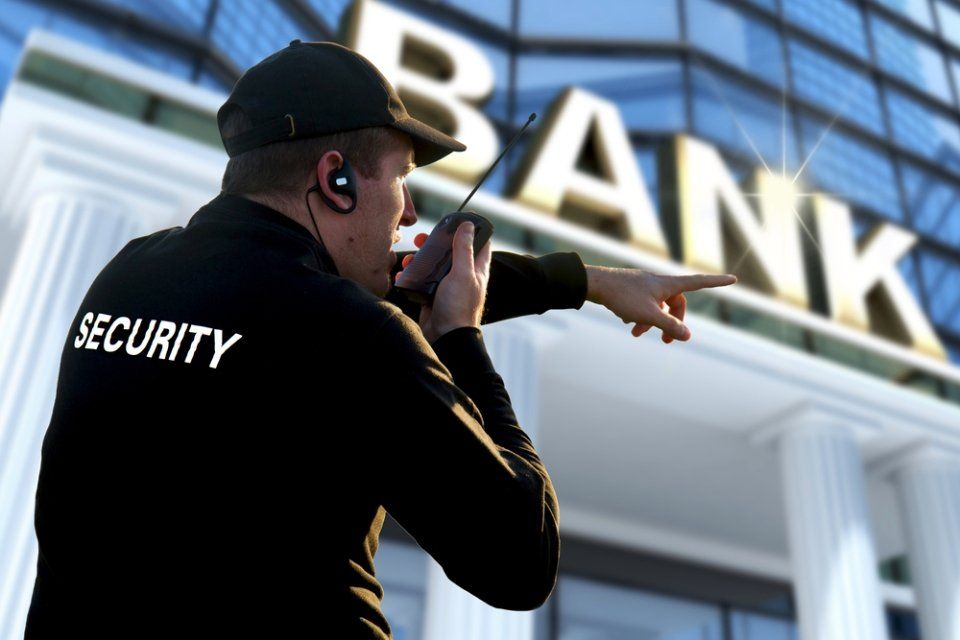 a bank guard informing to another person