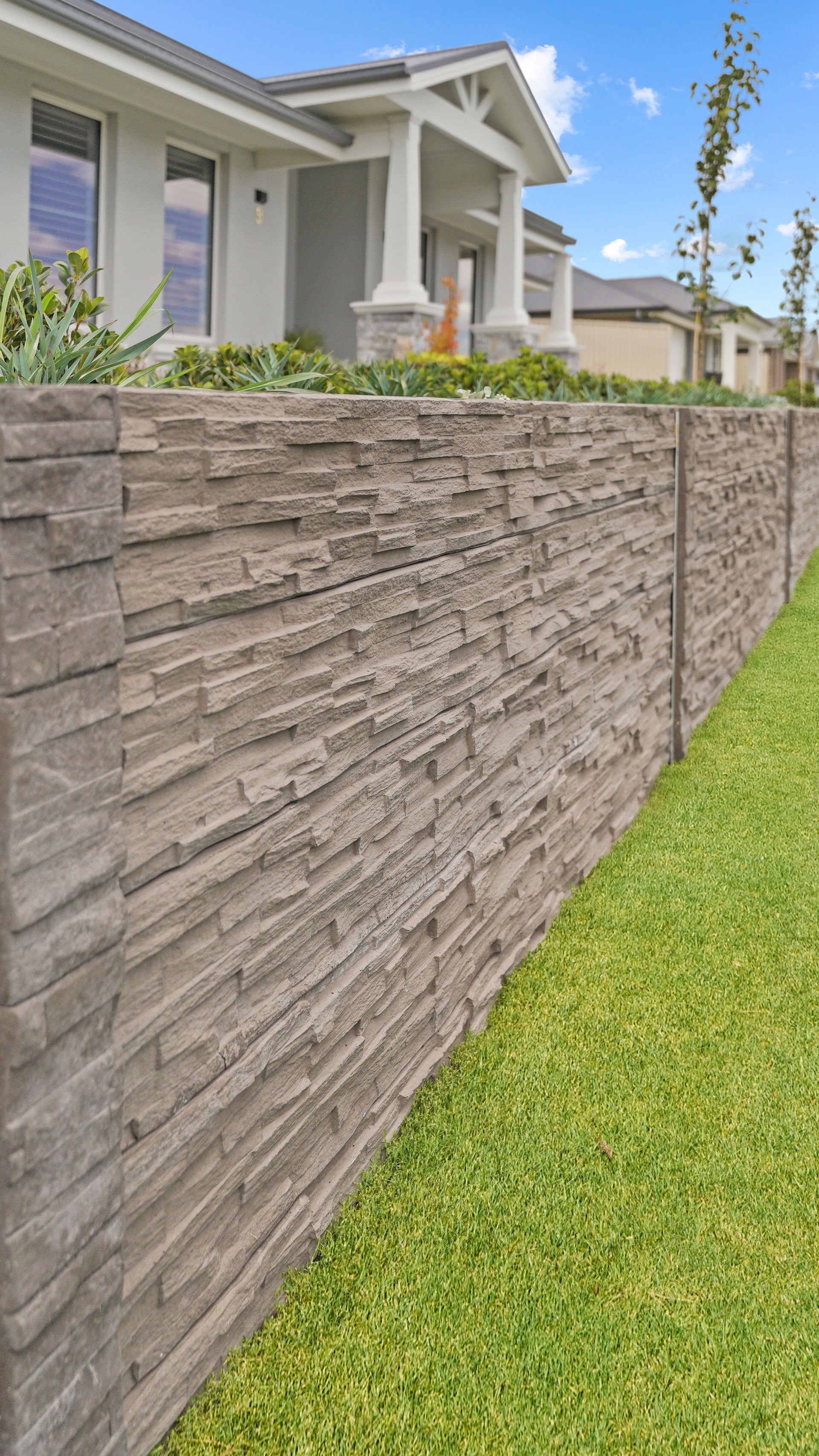 Concrete sleeper retaining walls in a modern residential landscape construction