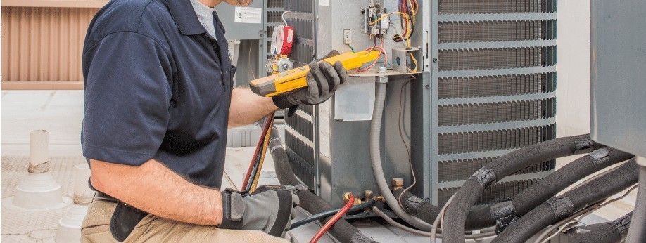 A person is fixing a tire with a screwdriver