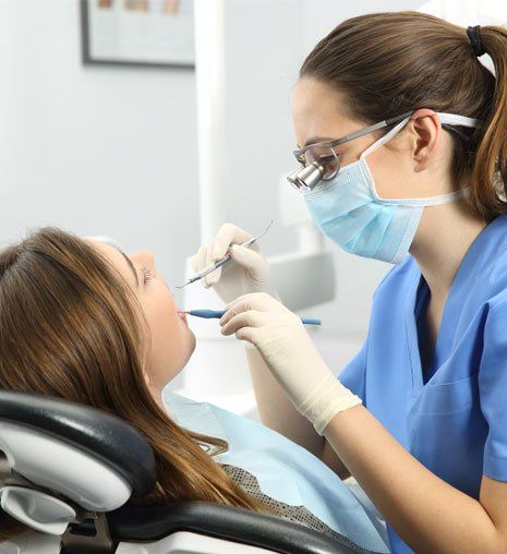 Dentist Examining a Patient Teeth — Alliance, OH — Kristine Sigworth, DDS