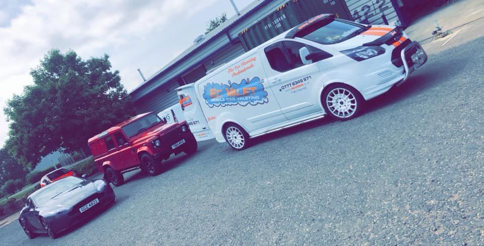 A van and a 4x4 post-valet service