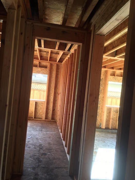 A hallway in a house that is being built.