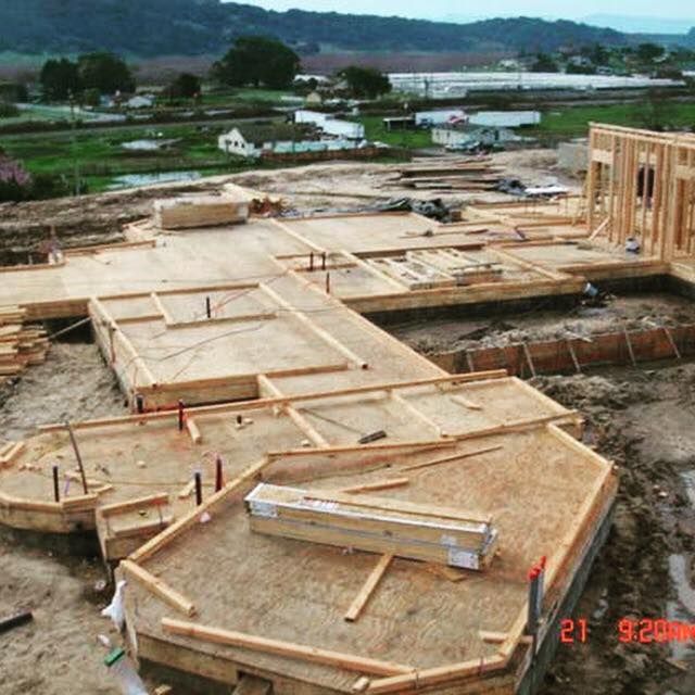 An aerial view of a house under construction with the date of february 21