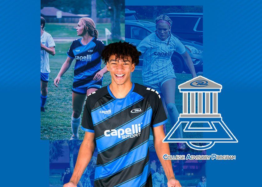 Soccer player smiling, in blue and black jersey, with other players in background. Logo of an organization.