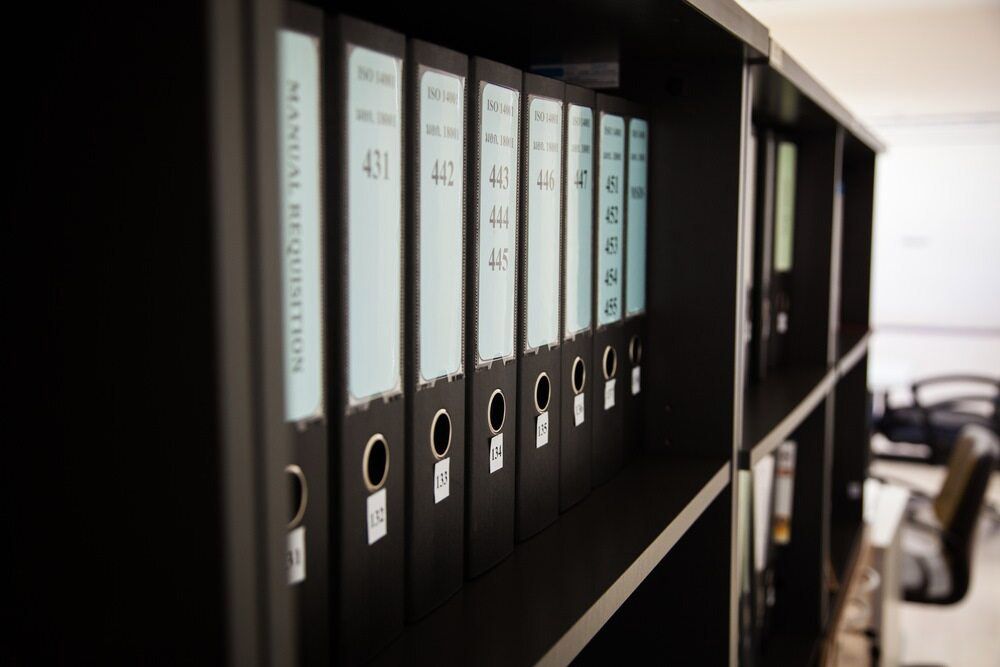 A Row Of Binders On A Shelf — Shop Fittings Office Furniture Materials Handling In Gosford, NSW