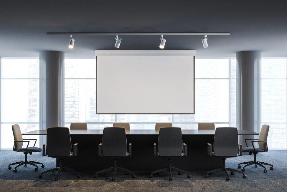A Conference Room With A Projection Screen — Shop Fittings Office Furniture Materials Handling In Gosford, NSW