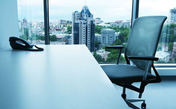 A Desk With A Chair And A Phone On It — Shop Fittings Office Furniture Materials Handling In Gosford, NSW
